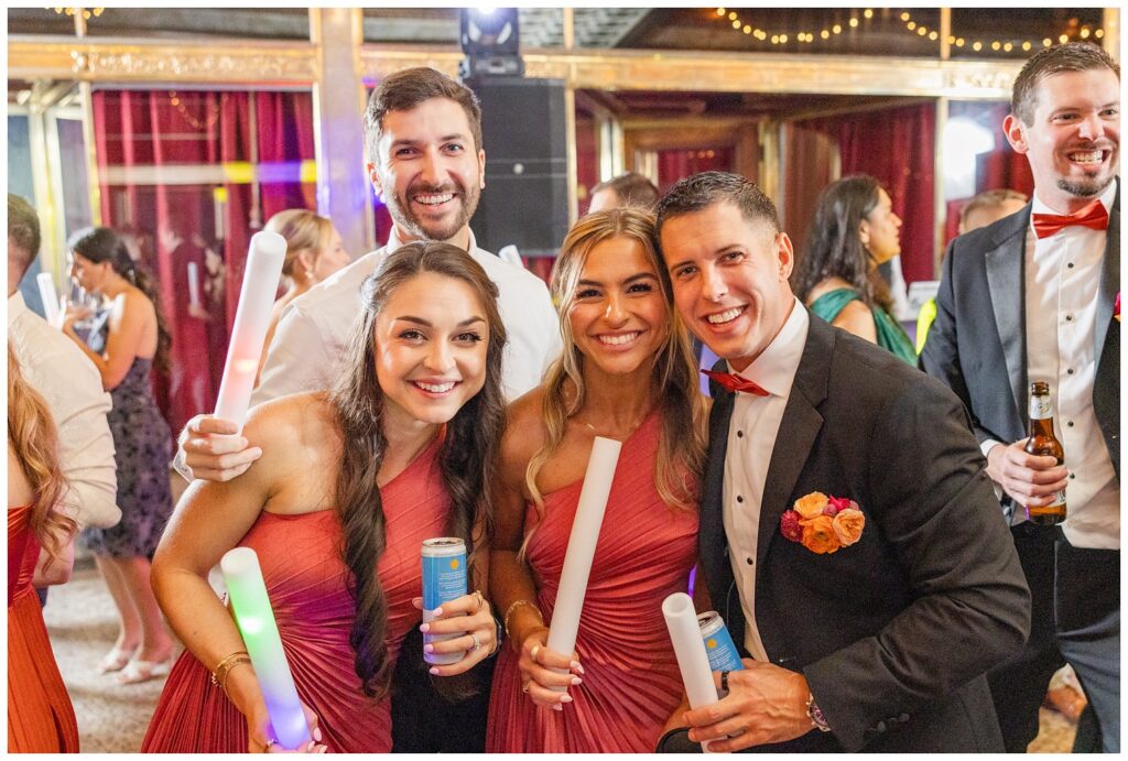 bridesmaids and groomsmen posing on the dance floor in Cleveland