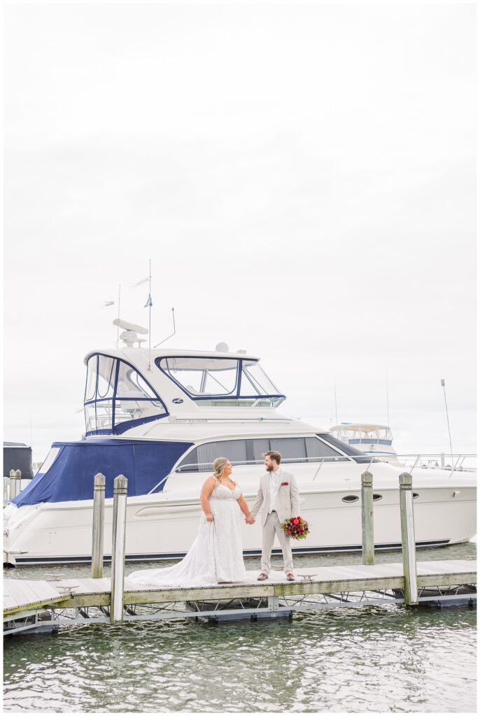 Sandusky, Ohio wedding portraits next to the boats at the yacht club