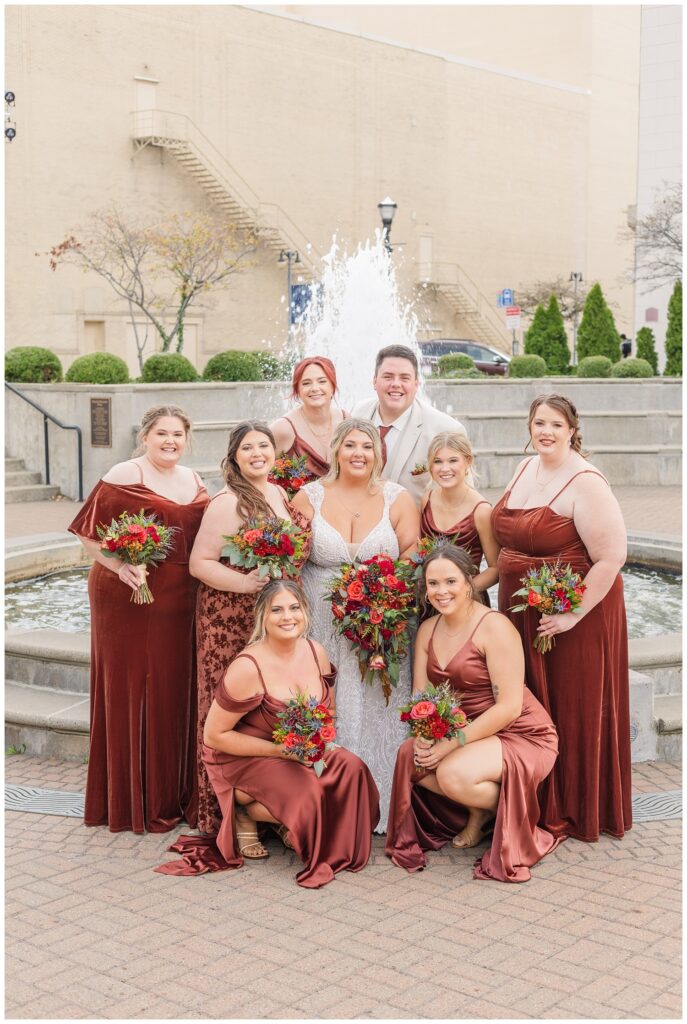 bride and her party posing together in front of the fountain in Sandusky, Ohio