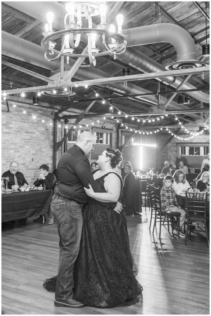 bride and groom have first dance after eating dinner at wedding reception in Ohio