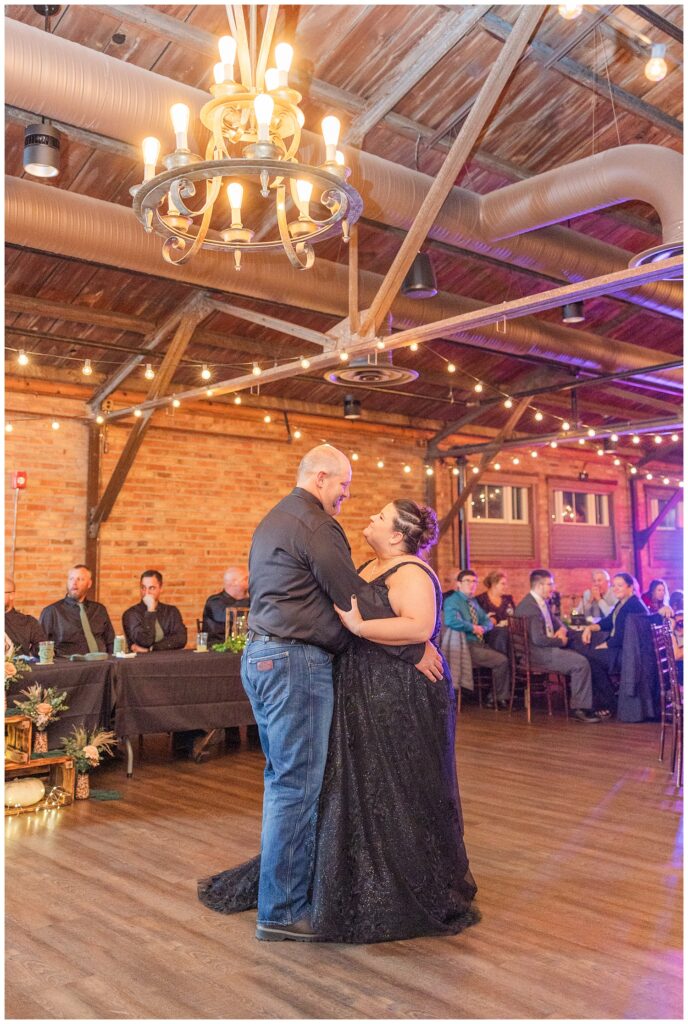 wedding couple have first dance after eating dinner at Pickwick Place fall reception