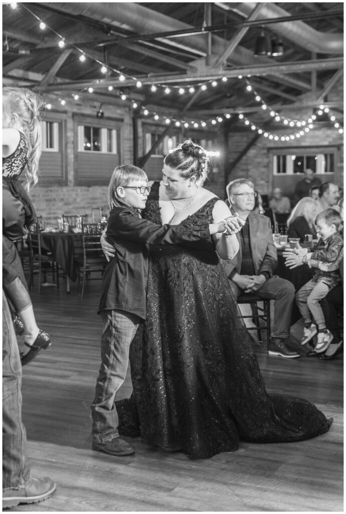 bride dancing with her son at Pickwick Place fall wedding reception