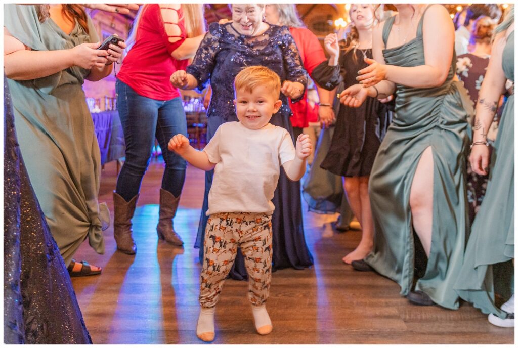 little kid dancing in the middle of a circle at fall reception in Bucyrus, Ohio