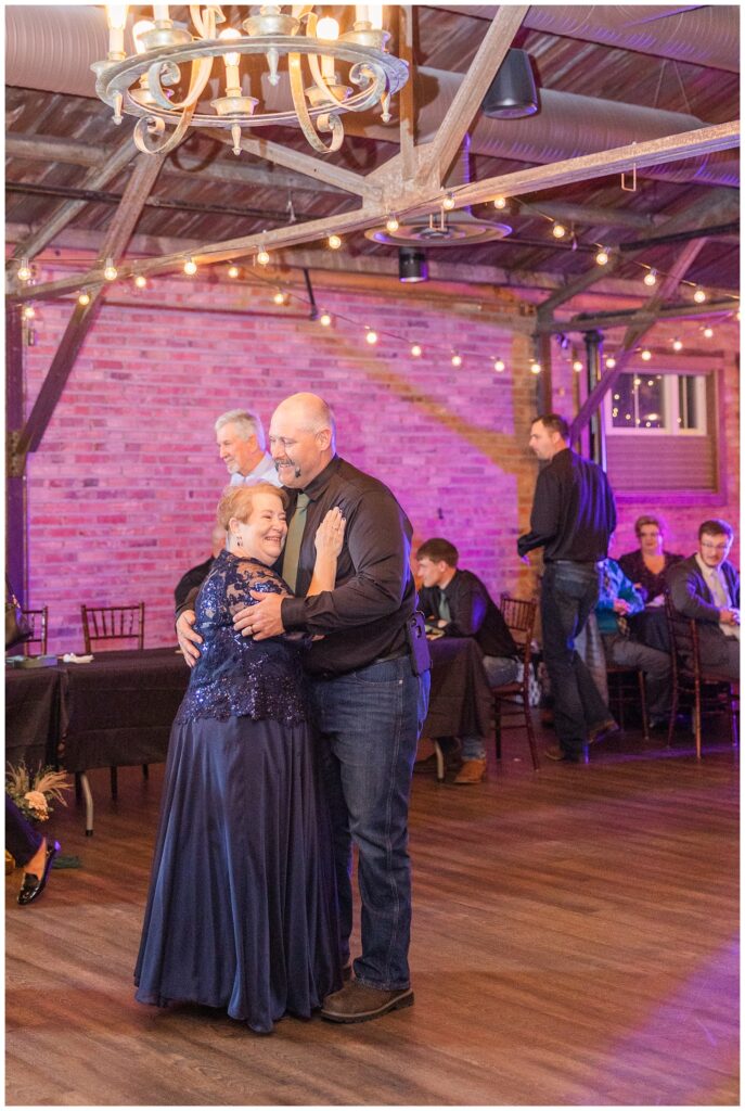 groom dancing with the bride's mom at fall wedding reception in Bucyrus, Ohio