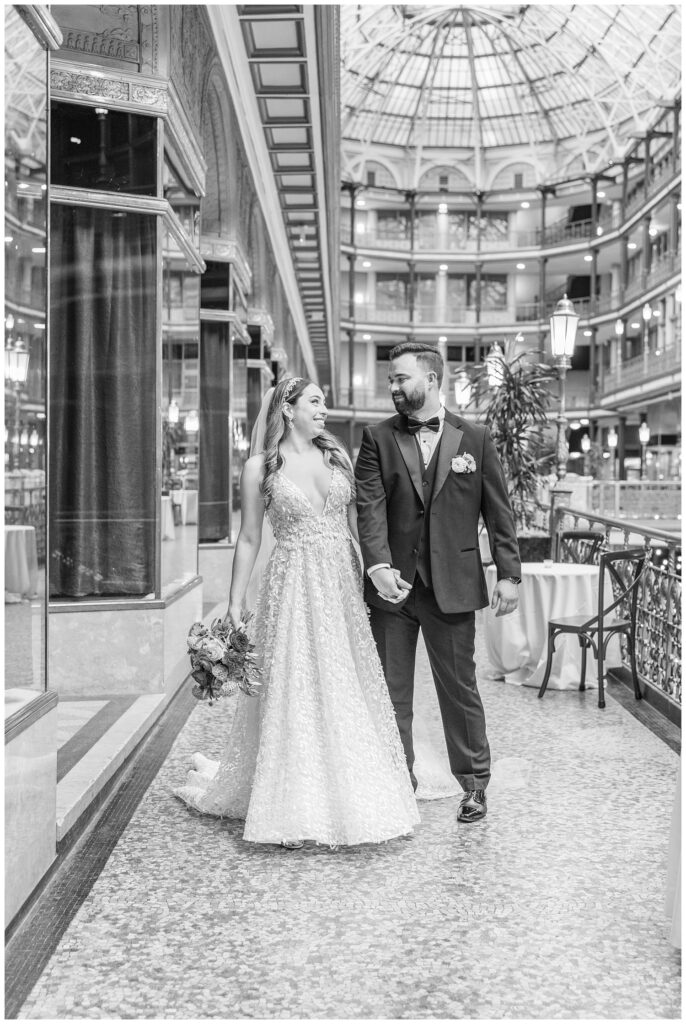 couple walking holding hands along the ships at the Arcade Cleveland