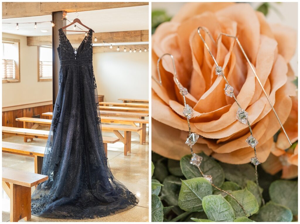 black lace wedding dress hanging from the rafters inside the barn wedding chapel