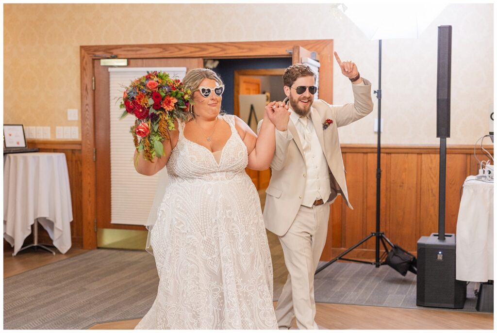 bride and groom walking into the reception at Sandusky Yacht Club