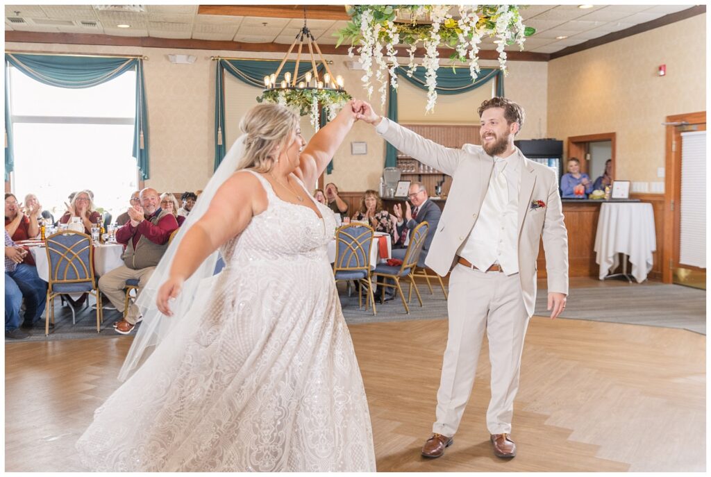 bride and groom twirling during first dance at the Sandusky Yacht Club in Ohio 