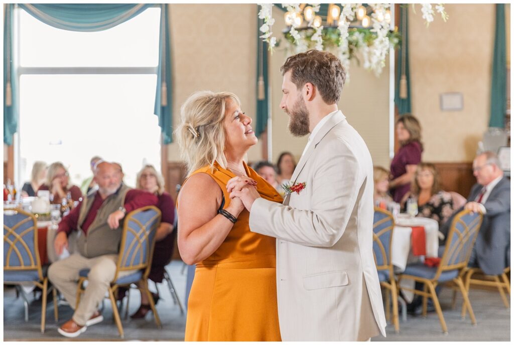 groom dancing with his mom during fall reception in Sandusky 