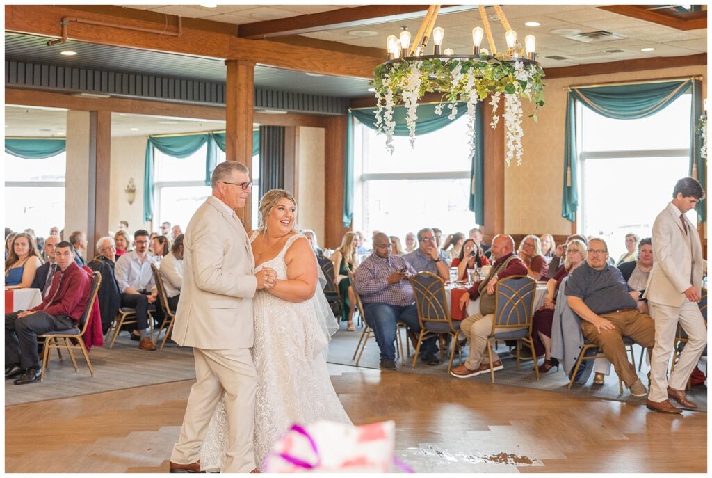 bride and her dad dancing at the fall reception at yacht club in Sandusky