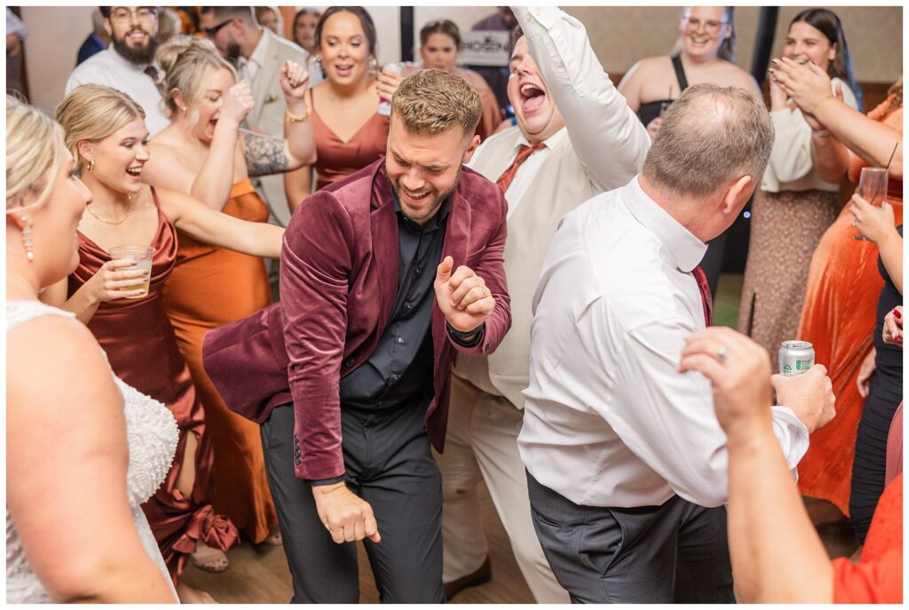 reception guests dancing at the wedding at the Sandusky Yacht Club 