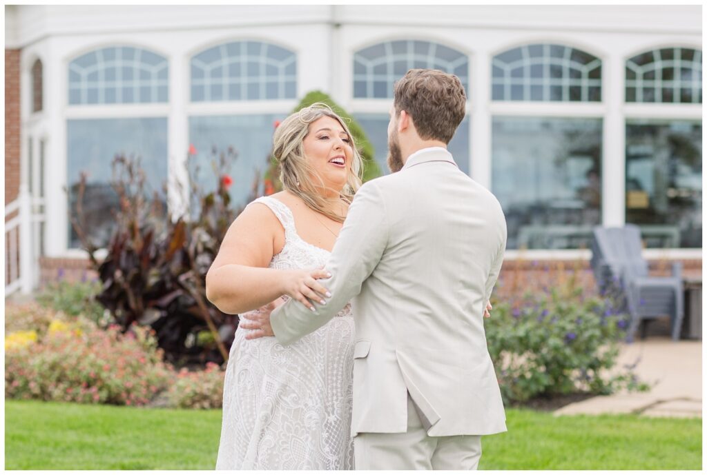 groom turning around to see the bride's expression during first look