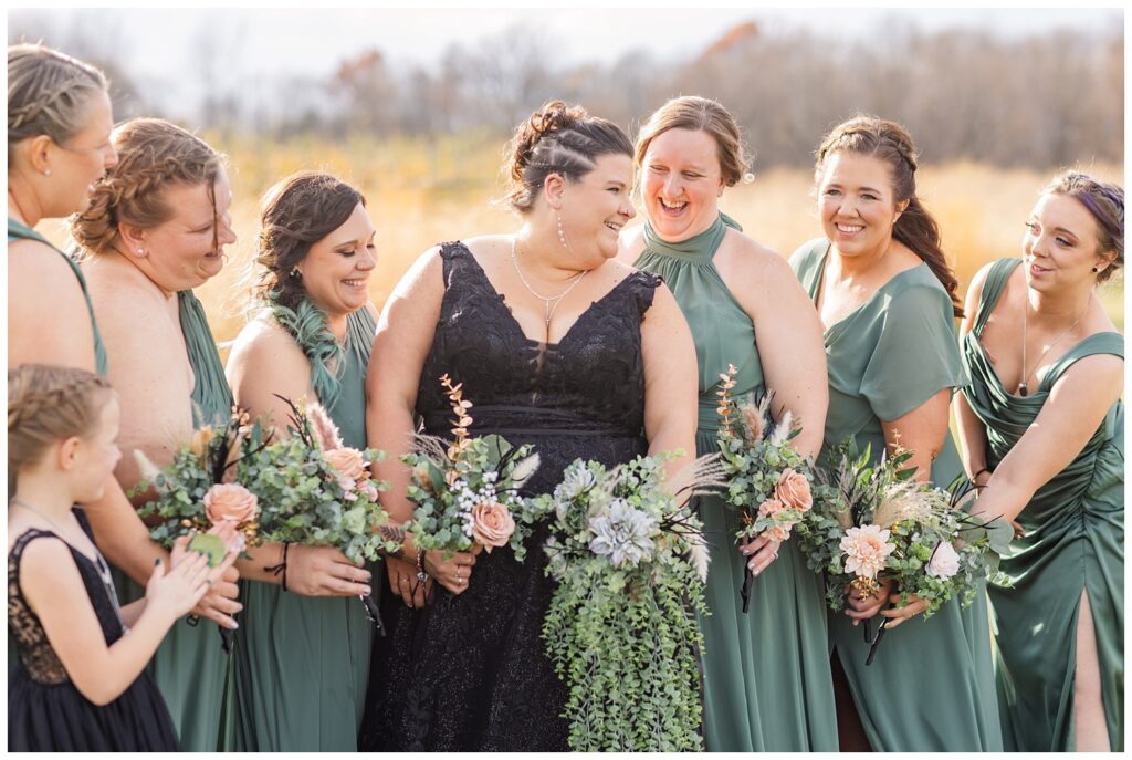 bridal party laughing together outside for Pickwick Place fall wedding