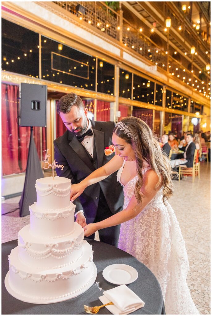 bride and groom cutting their cake at wedding reception at the Arcade Cleveland