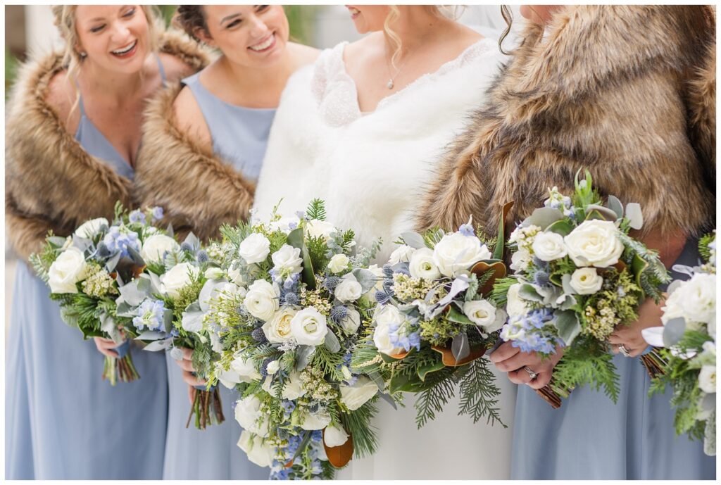 close up detail of the bridal party bouquets in the church courtyard in Fremont, Ohio