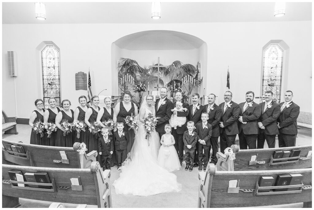 full wedding portrait with the groomsmen and bridesmaids at Monroeville, OH church