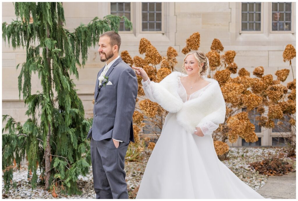 first look with the bride and groom outside the church ceremony in Fremont, Ohio