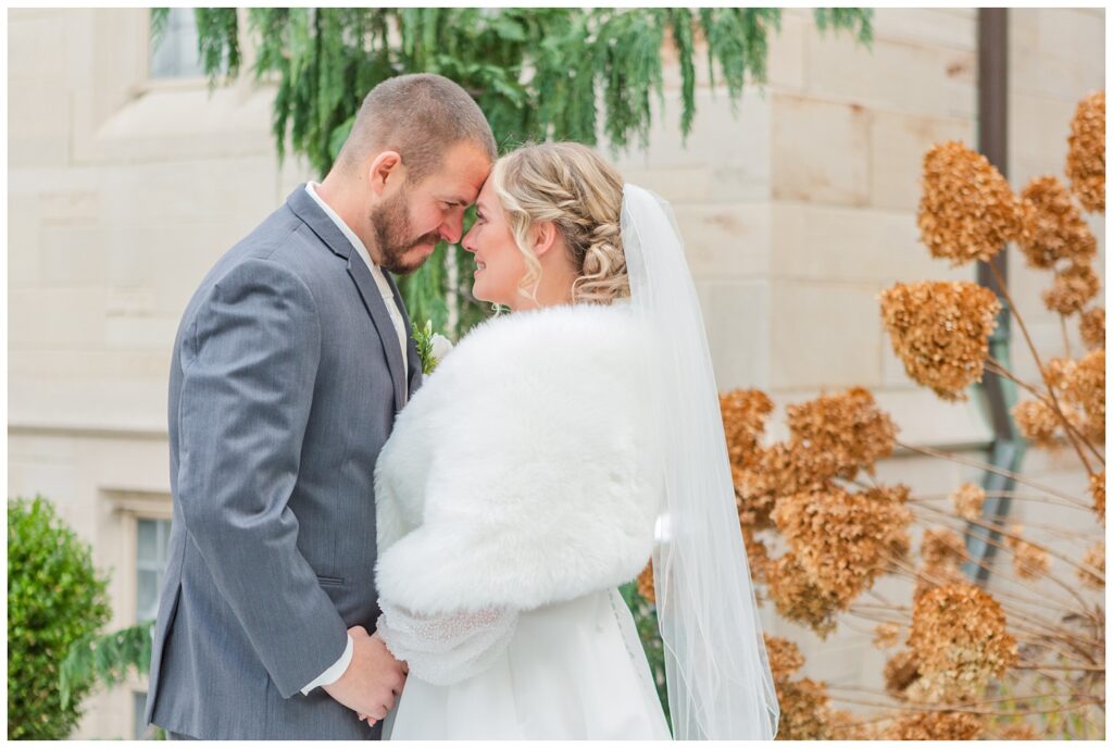 bride and groom portraits outside the church in Fremont, Ohio