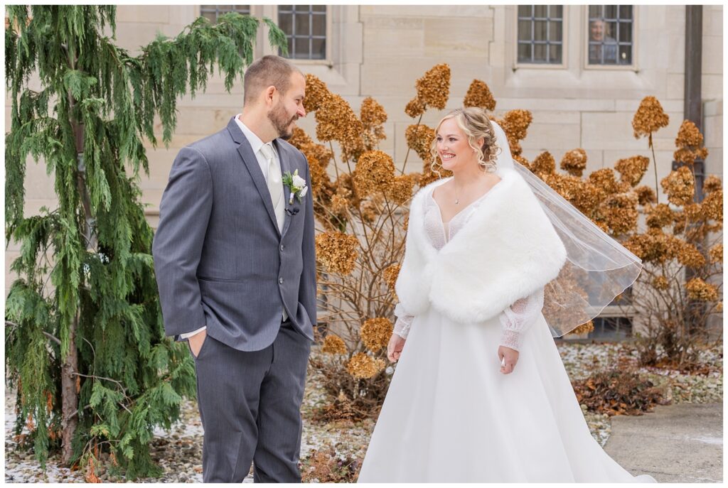 first look with the bride and groom outside the church ceremony in Fremont, Ohio