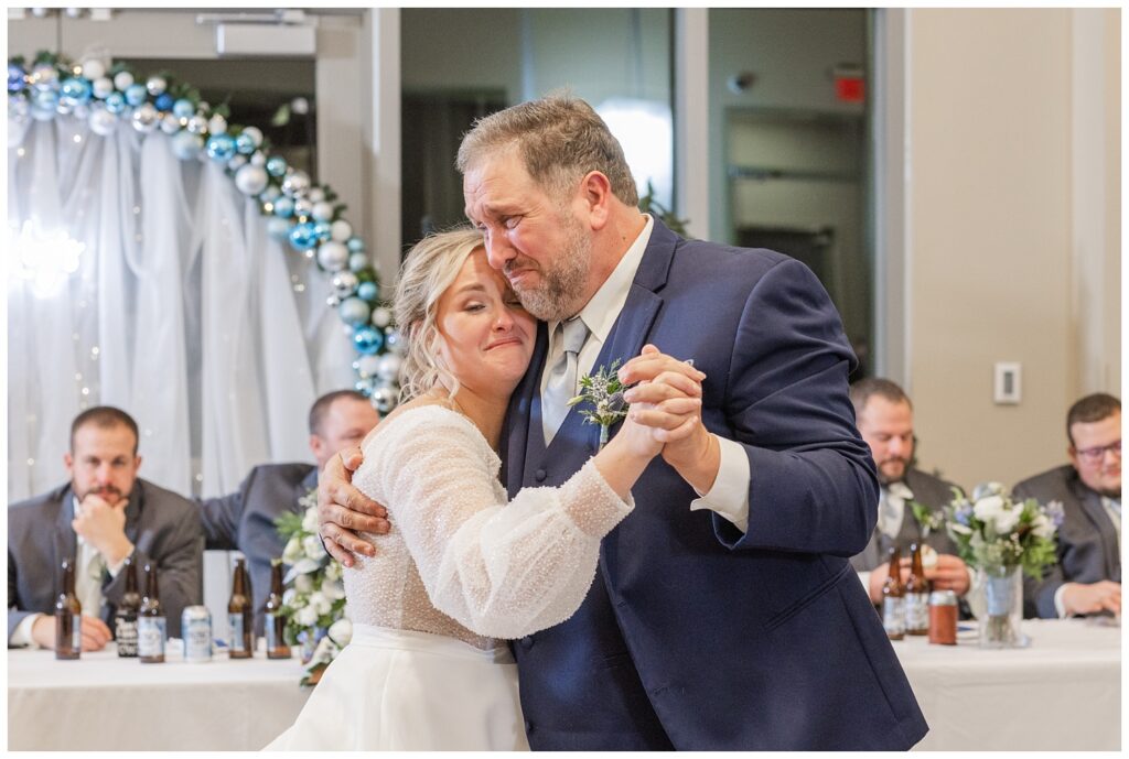 bride and dad cry while they have a dance at winter wedding reception in Fremont, Ohio