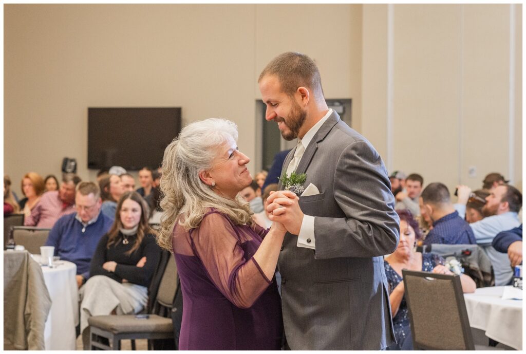 groom dancing with his mom at winter wedding reception in Fremont, Ohio