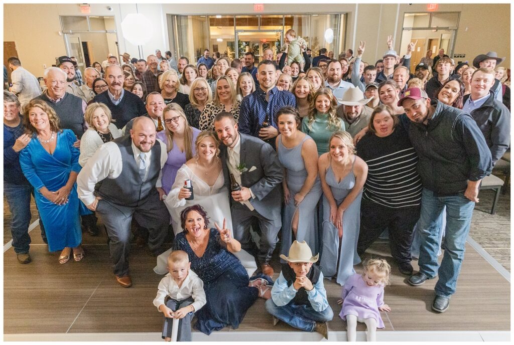 large group portrait of everyone from the winter wedding reception in Fremont, Ohio