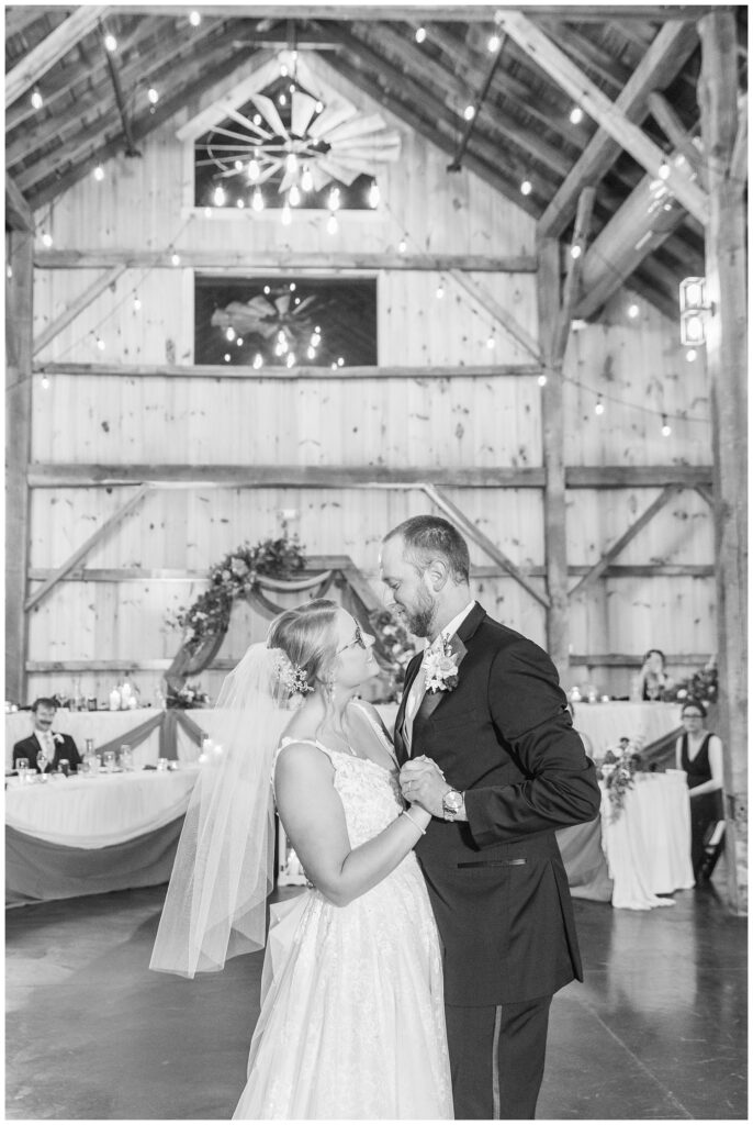 groom and bride have first dance at the Village Barn wedding venue in Monroeville, OH