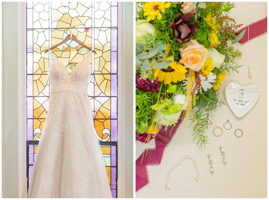 bride's lace wedding dress hanging in front of the church's stained glass window