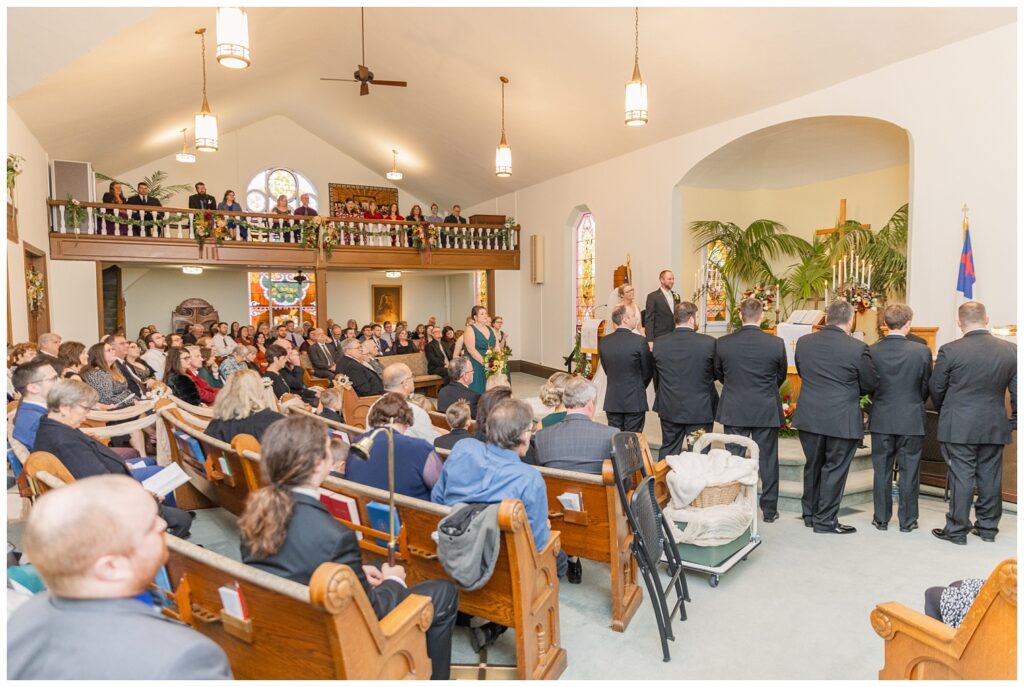 wedding guests looking on during ceremony at church in Ohio