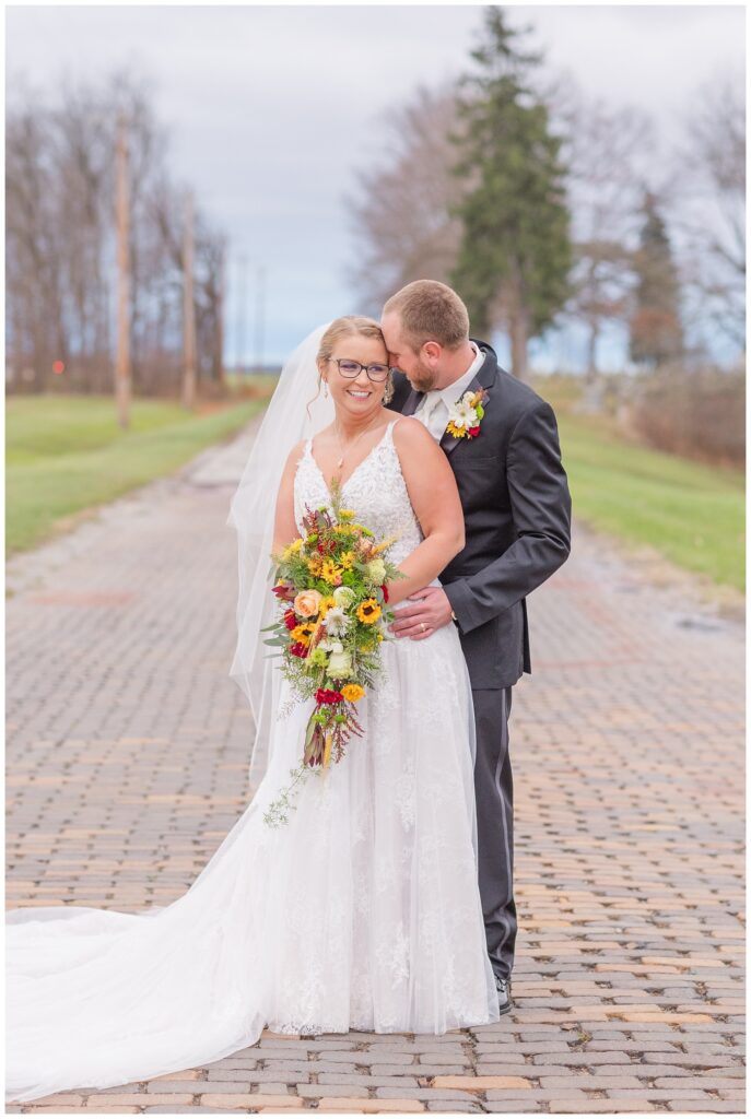 wedding couple laughing and posing on a brick road in Monroeville, OH