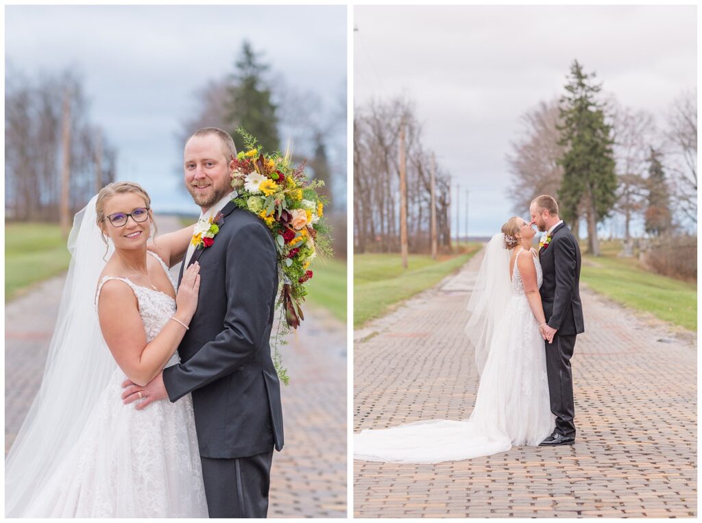 wedding couple holding hands and smiling at each other near the Village Barn venue