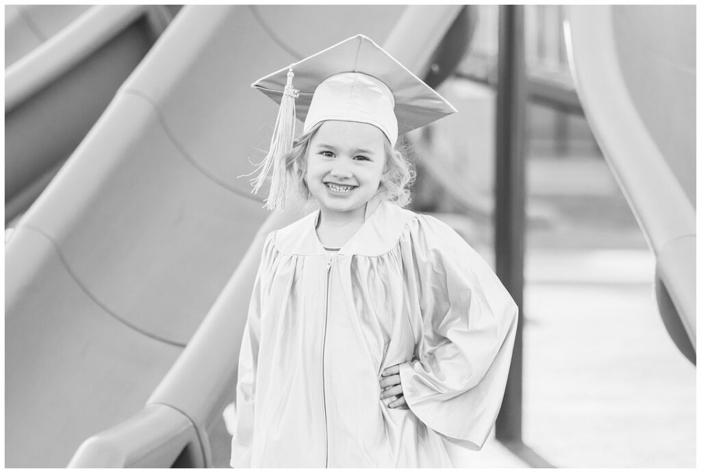 girl wearing a graduation cap and gown for mini session in Tiffin, Ohio