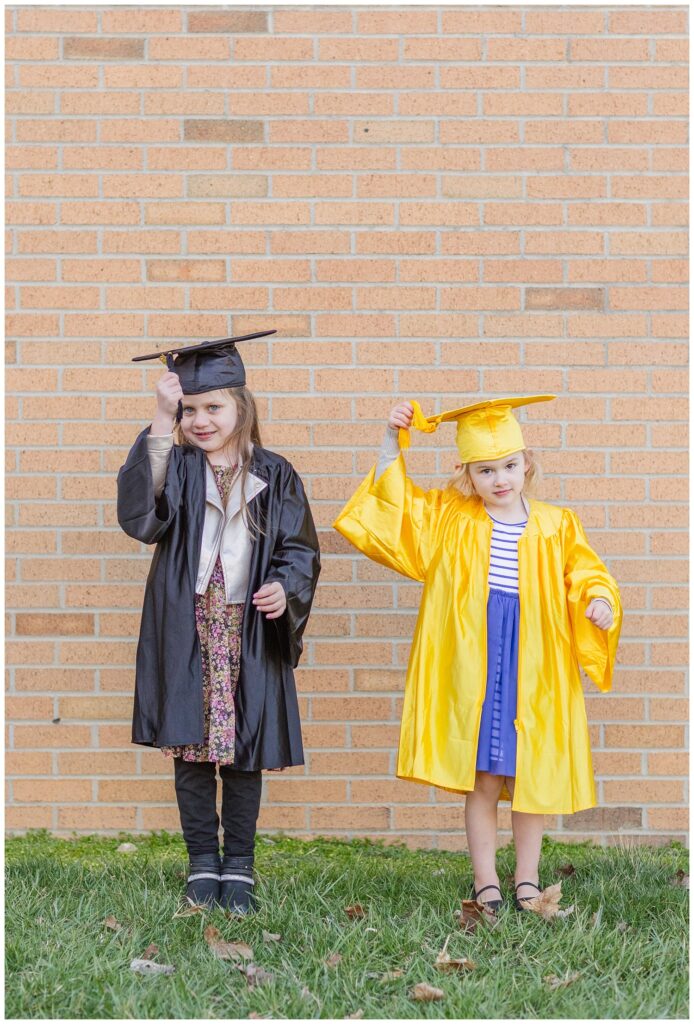 girls changing their tassels on their graduation caps in Green Springs, Ohio