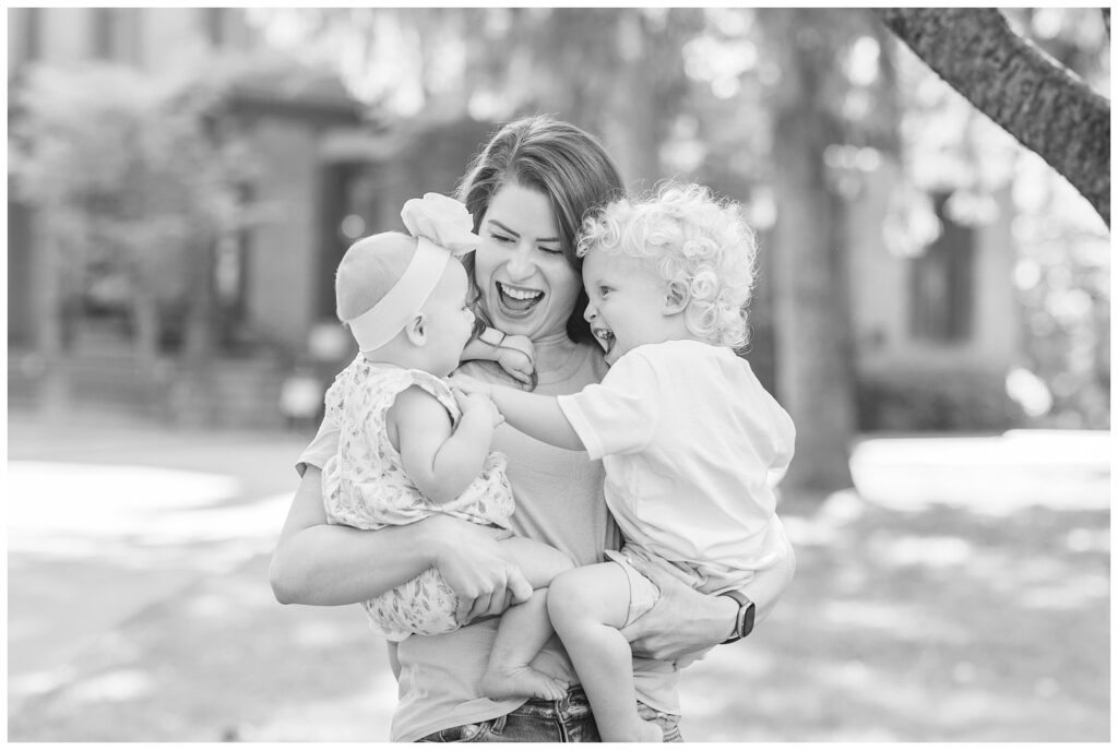 past bride holding her two kids at a family session in Green Springs, Ohio