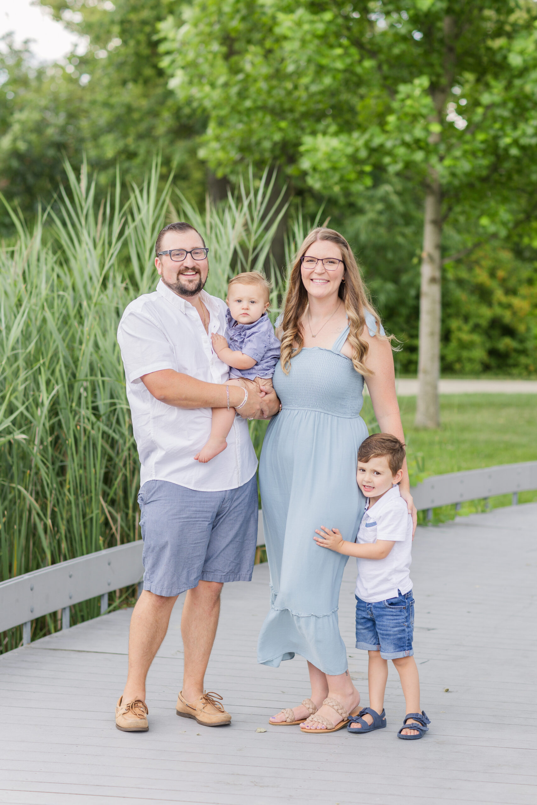 family posing for portraits with their children after their wedding