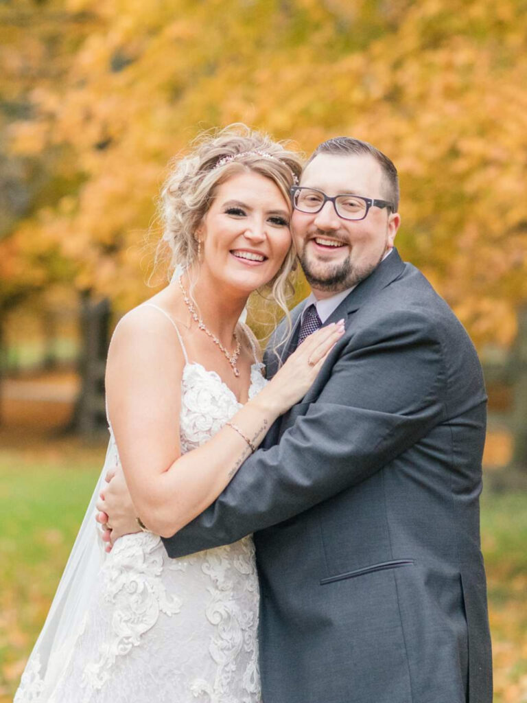 wedding couple holding each other for fall ceremony in Fremont, Ohio