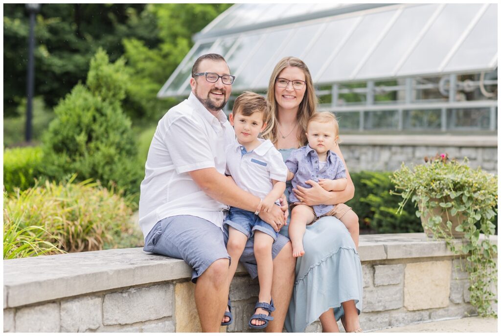past wedding couple posing with their children for a family session in Green Springs, Ohio
