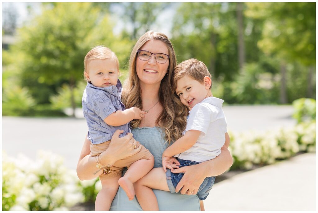 past bride of Fremont, Ohio wedding photographer holding her two small kids
