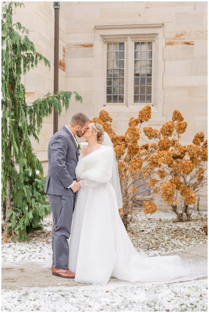 bride and groom posing with Fremont, Ohio wedding photographer