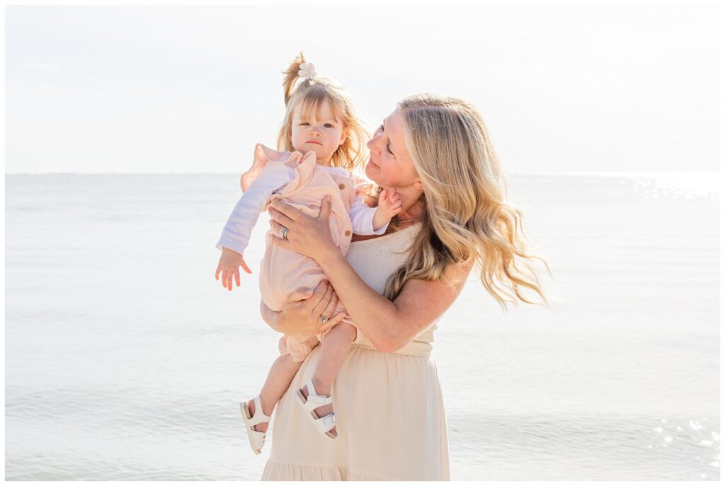grandmother holding her granddaughter next to Lake Erie at family session