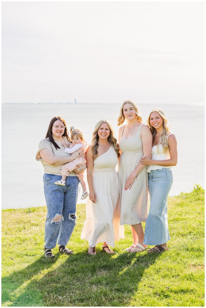 family members posing together on the grass with South Bass Island photographer