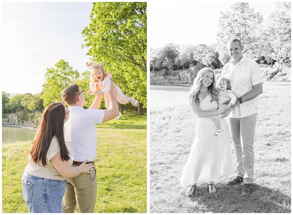 husband and wife holding up their daughter and posing on the grass in South Bass Island