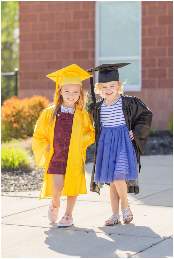 school graduation mini session with two preschool girls