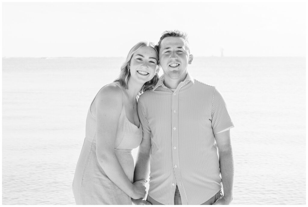 couple posing together at the lake with South Bass Island photographer