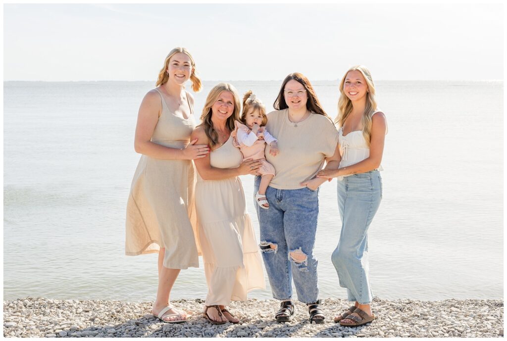 all of the female family members posing with the granddaughter on the beach on South Bass Island