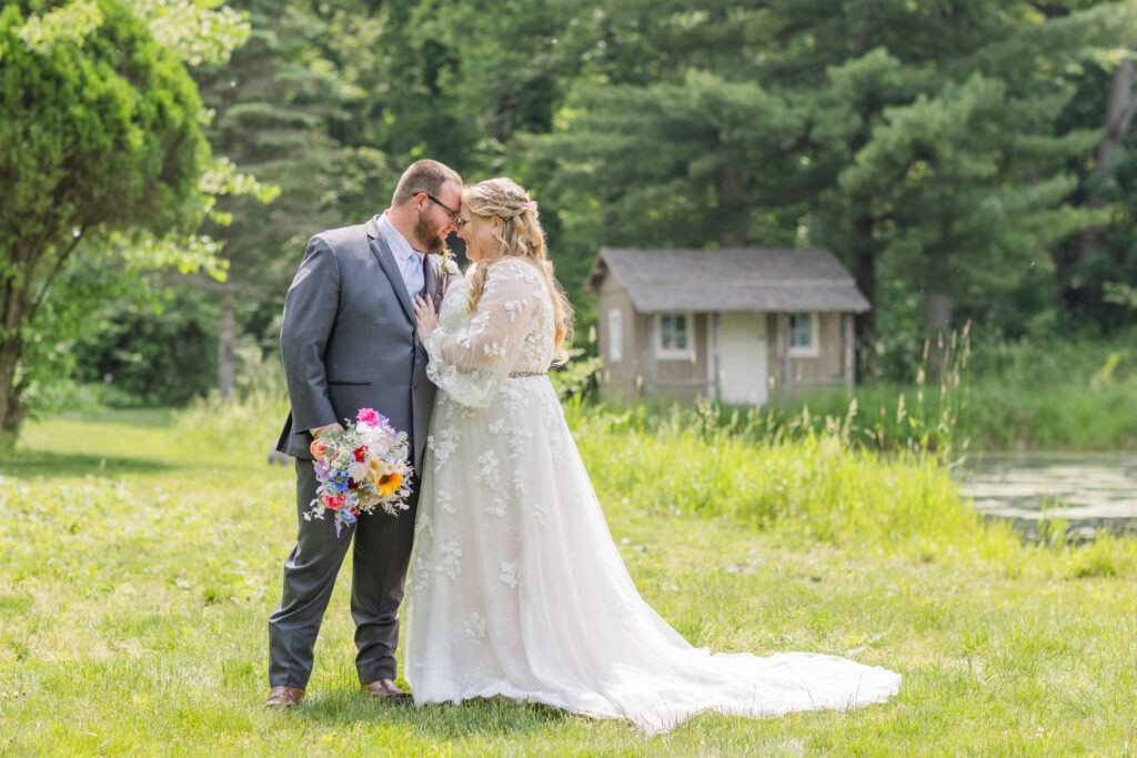 bride and groom posing at Bradner Preserve for summer wedding at Ohio family farm