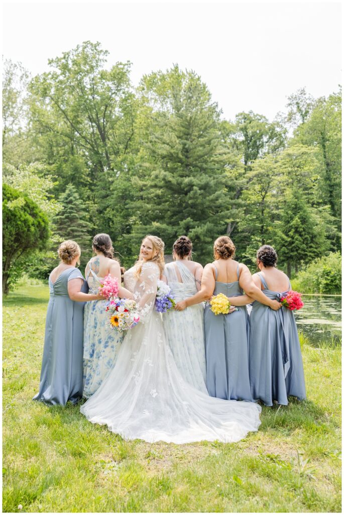 bride turned to the side while bridesmaids look away at Bradner Preserve
