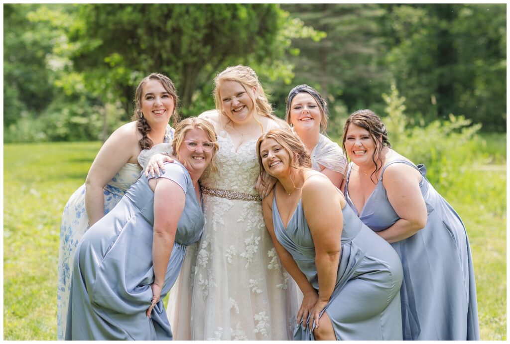 bridal party posing with bride for portraits at Bradner Preserve