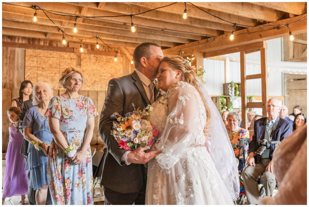 bride's dad giving her away during wedding ceremony in Risingsun, Ohio