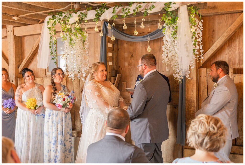 wedding couple sharing their vows at family farm ceremony in Risingsun, Ohio